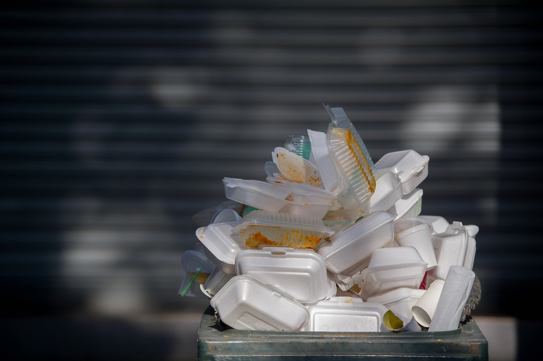 pile of waste foam and plastic in bin.non degradable waste that is destroying nature